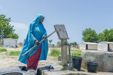 Kellu umar fetching water from the hand pump borehole.