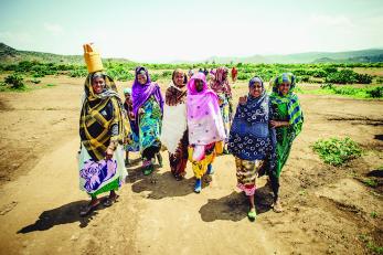 A group of women in ethiopia walking together in colorful scarves