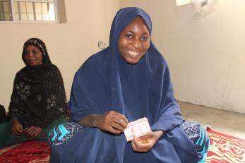 Fatima shows off the nafdac registration sticker for her products