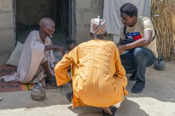 Mercy corps staff, emmanuel obute (right) interviewing mohammed kami (left) at his residence.