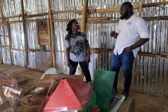 A business owner speaking with a staff member.