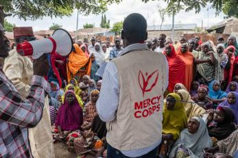 Mercy corps employee speaks to community.