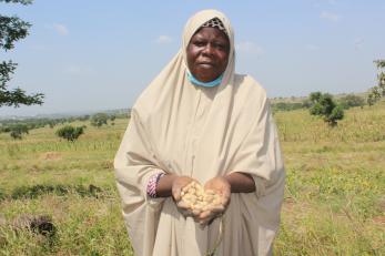 A person holding crops