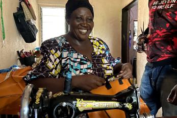 A person using a sewing machine.