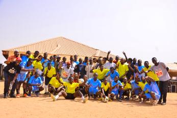 Football team members taking a group photo.