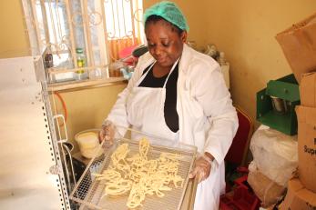 A person using a dehydrator.