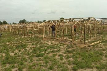 A person building a structure.