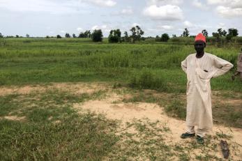 A person standing in a field.