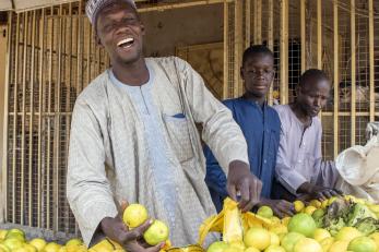 A vendor selling fruit.