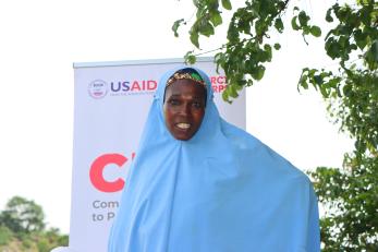 A Women's group leader, poses for a photo after a meeting by the group.