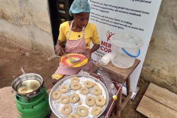A business owner preparing to dry doughnuts.