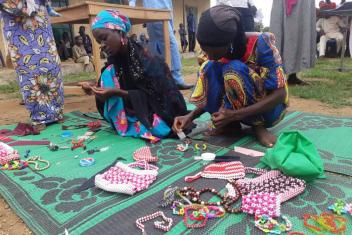 Balkisu Buhari showcases her bead making skills and wares she made. 
