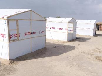Completed shelters lined up in a row.